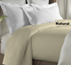 Alyssa natural coverlet shown on bed