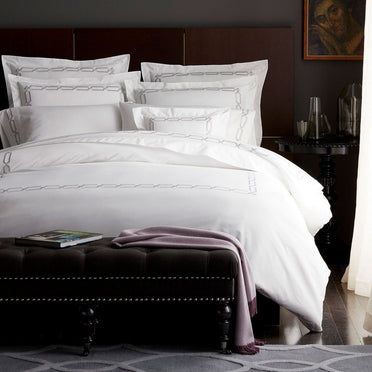 Arezzo white bedding collection with chain border
